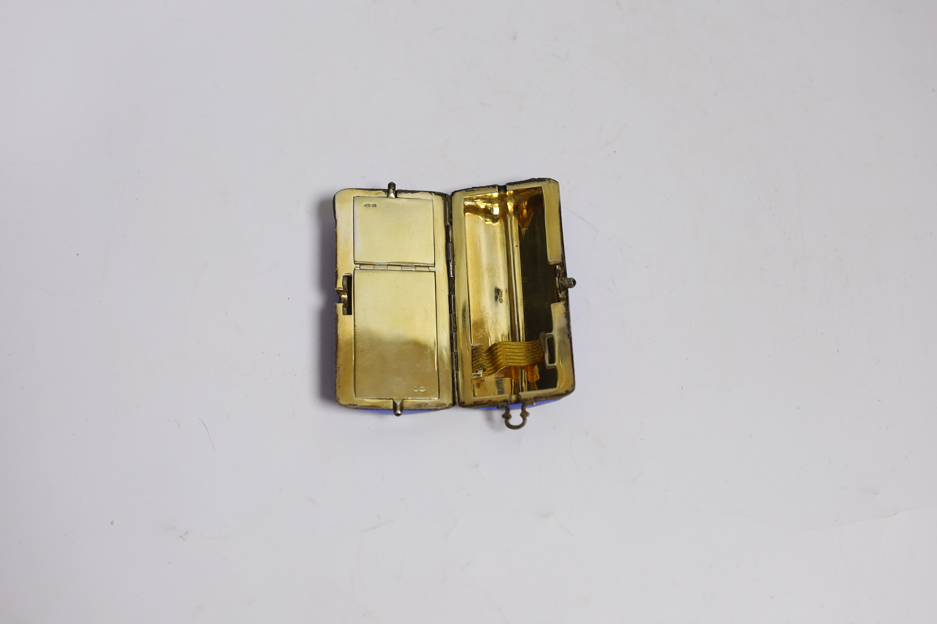 A lady's George V silver gilt and guilloche enamel minaudiere, of shaped oval form with compartmental interior, import marks for P.H. Vogel & Sons, London, 1923, 81mm.